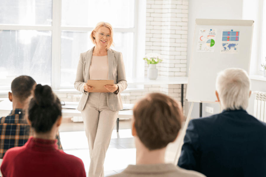 Parent coach lecturing other education professionals