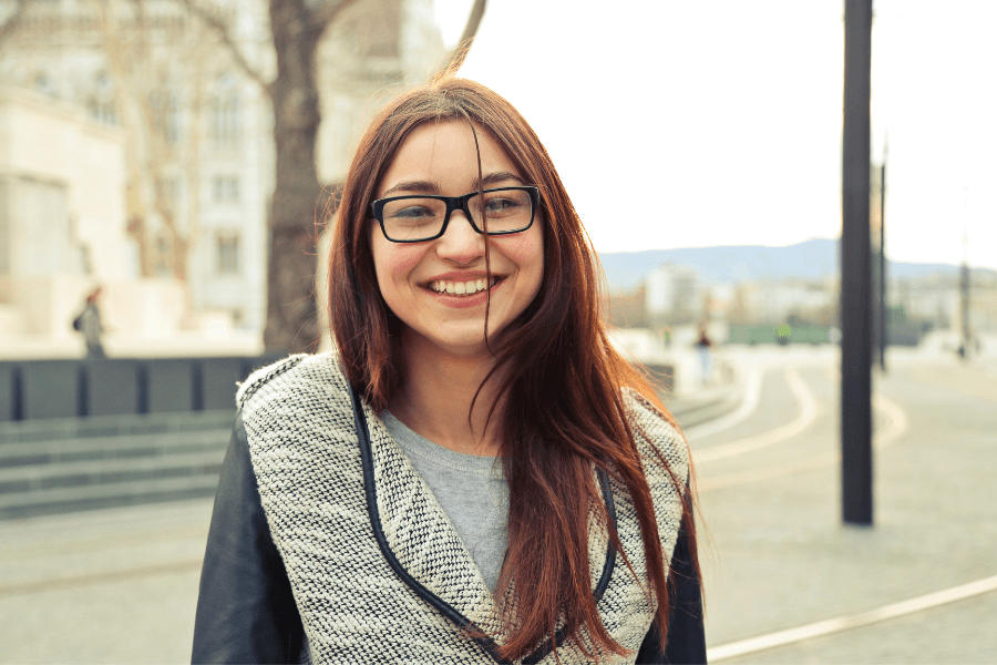 Happy teen girl on the street